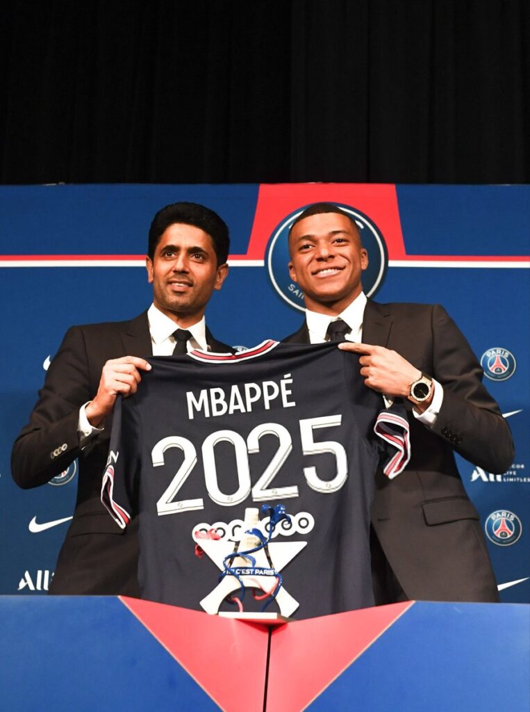 Mbappe and PSG president Nasser Khelaifi during his extension