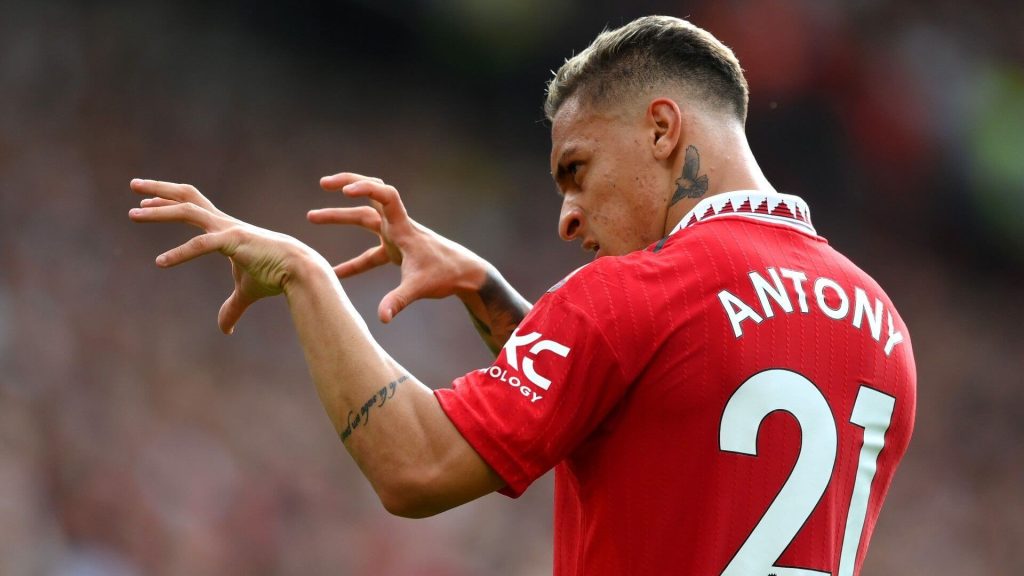 Antony, in red uniform in jersey No 21, gestures during a break from a match. Antony is keen on staying with United despite interest from Fenerbahce