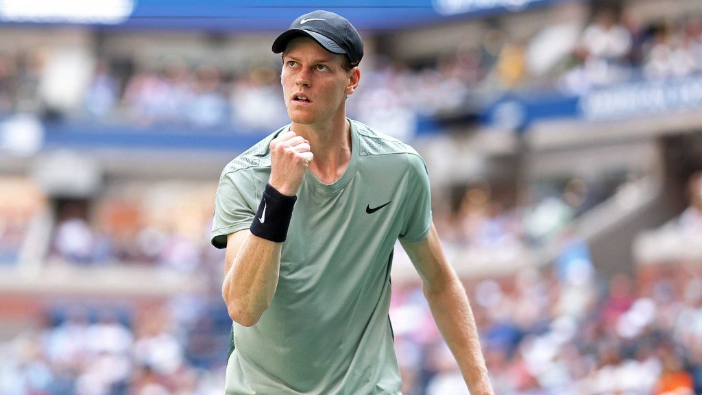 Jannik Sinner, in green shirt, celebrates a point at his US Open match
