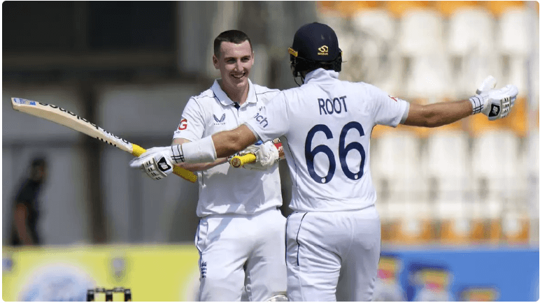 Harry Brook smiles as he acknowledges teammate Joe Root in their recent Test match. Brook has the qualities to top Root and Kevin Pietersen, says James Anderson.