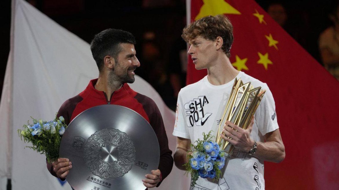 Jannik sinner, right in white shirt, chats with Novak Djokovic, left, in red shirt, at awards ceremony. Sinner foils Djokovic's bid for 100th title to win Shanghai Open title.