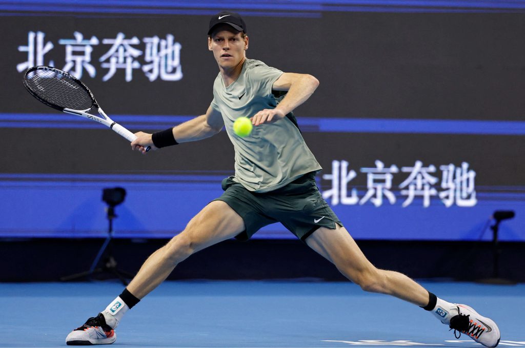 Jannik Sinner, in light green shirt, in action at the China Open. Sinner tries to stay focused amid the WADA appeal on his anti-doping case