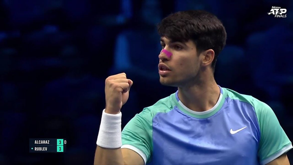 Spain's Carlos Alcaraz, in light blue/green shirt, pumps his fist, in his match against Andrey Rublev on Wednesday. Alcaraz drops Rublev, still in contention in ATP Finals