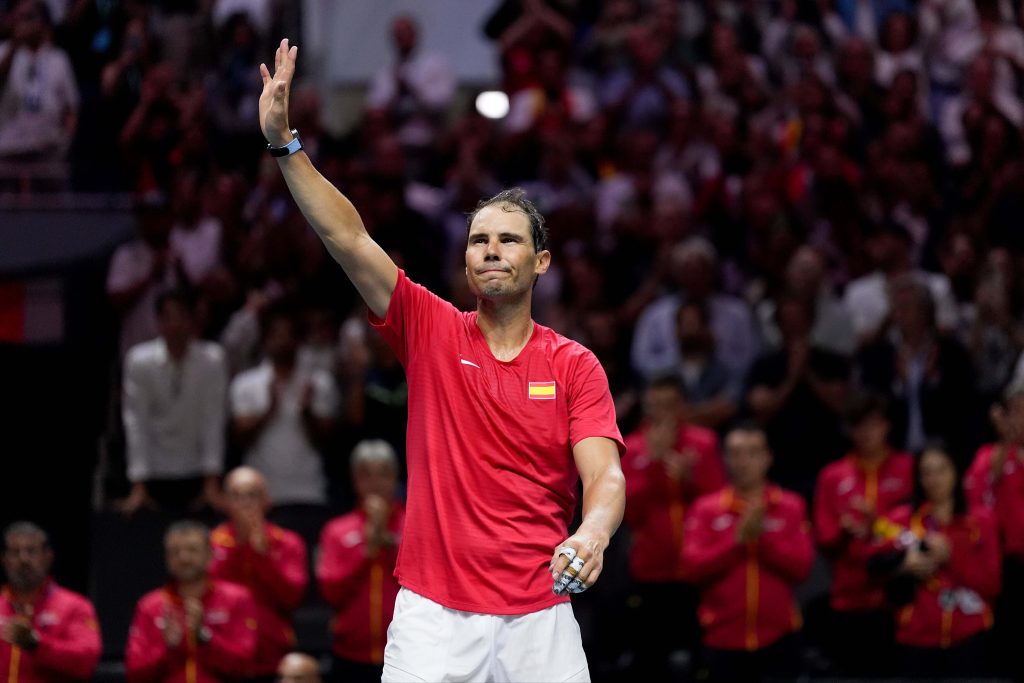 Rafael Nadal, in red, waves to the crowd after his last match at the Davis Cup for Spain against the Netherlands on Monday. Nadal, Federer could be Europe's Laver Cup captains
