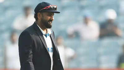 India captain Rohit Sharma, in black suit, ponders his next move in the pitch in file photo. Sharma says India 'failed as a unit' after whitewash from NZ