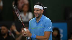 Juan Martin del Potro (in blue) still managed a smile in his farewell exhibition match on Sunday. Djokovic 'grateful' to play with Del Potro in Argentine's last match