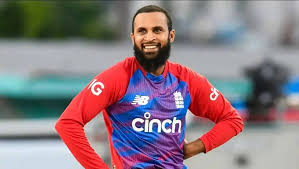 England's Adil Rashid looks on during a break at a Test match in file photo. Rashid leads ICC T20I bowlers rankings