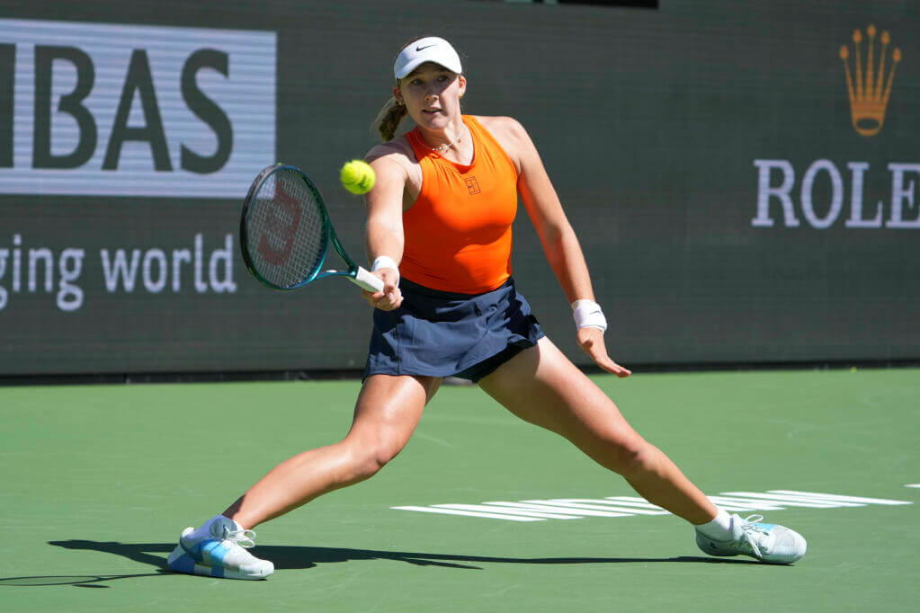 Russia's Mirra Andreeva sklides on a shot in her BNP Paribas Open finals match against Belarus;' Aryna Sabalenka over the weekend. Sabalenka cites Andreeva's early success to Martinez as coach  