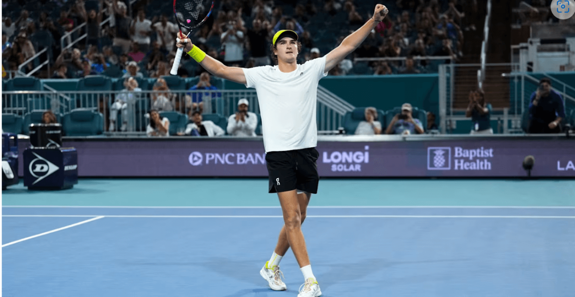 Brazilian Joao Fonseca raises his arms in celebration at the Miami Open on Thursday. Fonseca wins in Miami