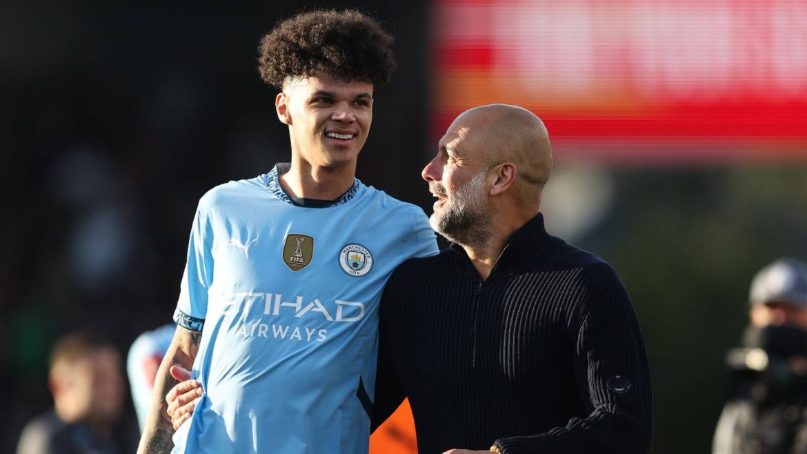 Midfielder Nico O'Reilly (left) and manager Pep Guardiola (right) share a conversation during a break in Man City's match against Bouyrnemouth on Sunday. Bournemouth vs Man City saw O'Reilly impact in comeback win