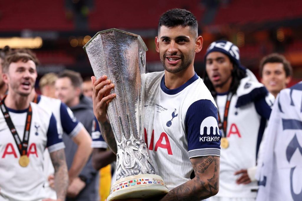 Tottenham Hostpur center-back Christian "Cuti" Romero (midqdle) hiolds the trophy after his team won the Eurpean League in file photo. Romero's La Liga plan aims to help Messi's FIFA World Cup goals