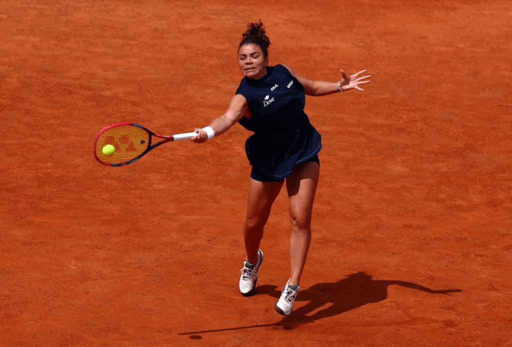Italian Jasmine Paolini stretches to return a shot againt Diana Shnaider at the Italian Open on Tuesday. Sinner, Paolini delight home fans at Italian Open; Alcaraz wins