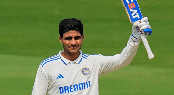 Veteran India cricketer Shubman Gill raises his arm and bat in approval during a lull in his match in file photo. BCCI, Gambhir mull Sharma's captaincy future in England Tests