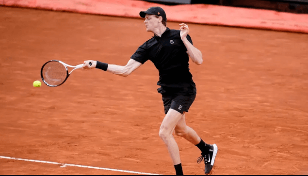 Italy's Jannik Sinner uses his right arm to hit a shot before his home fans at the Italian Open on Tuesday. Sinner, Paolini delight home fans at Italian Open; Alcaraz wins
