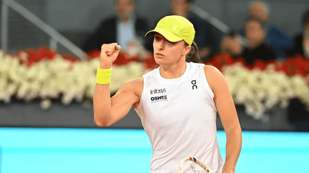 Poland's Iga Swiatek pumps her fist in file photo. Sabalenka widens PIF Race to WTA Finals lead after Madrid win