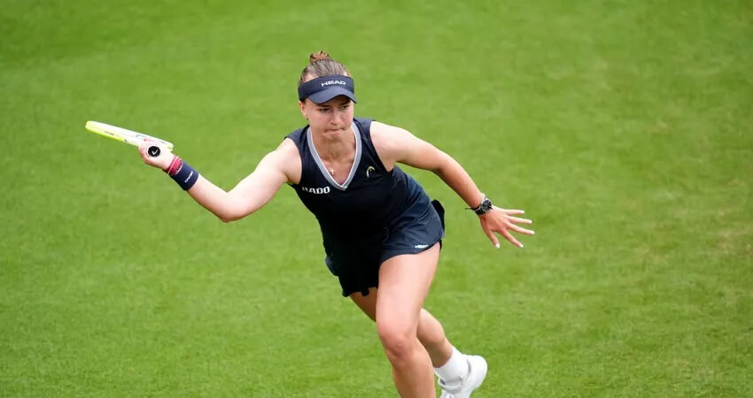 Czechia player Barbora Krejcikova stretches for a shot in file photo. The defending Wimbledon champion will open her campaign against Alexandra Eala of the Philippines at the All England Club on Tuesday. Eala rises to No.56 amid Eastbourne final loss, eyes Wimbledon next