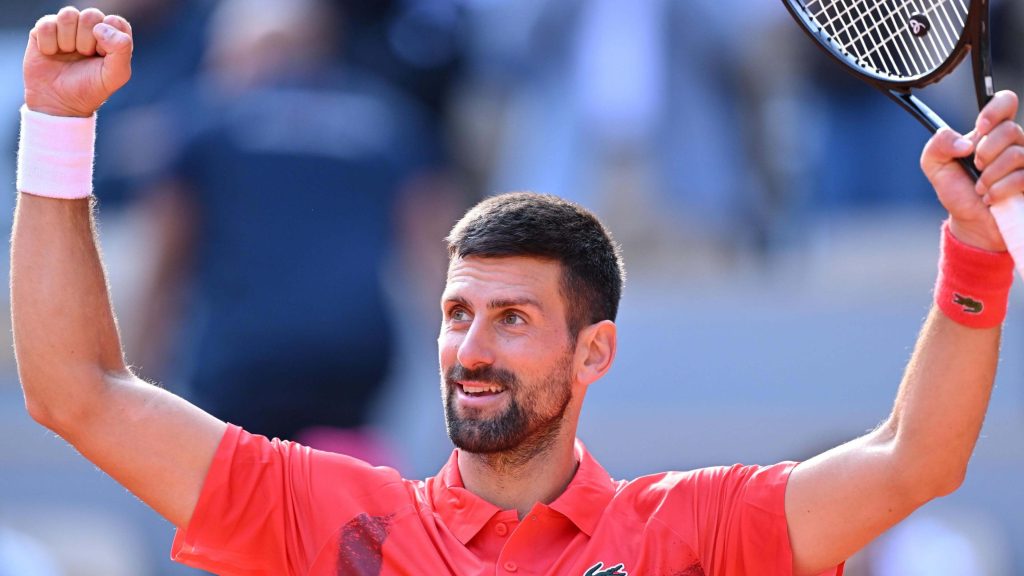 Serbia's Novak Djokovic raises his arms in triumph after his French Open quarterfinal against Alexander Zverev on Wednesday.