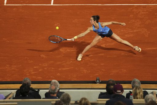 Frenchwoman Lois Boisson stretches to return a shot during her French Open 2025 quarterfinals match against Russia's Mirra Andreeva n Wednesday. Boisson stuns Andreeva for French Open semis spot; Gauff wins