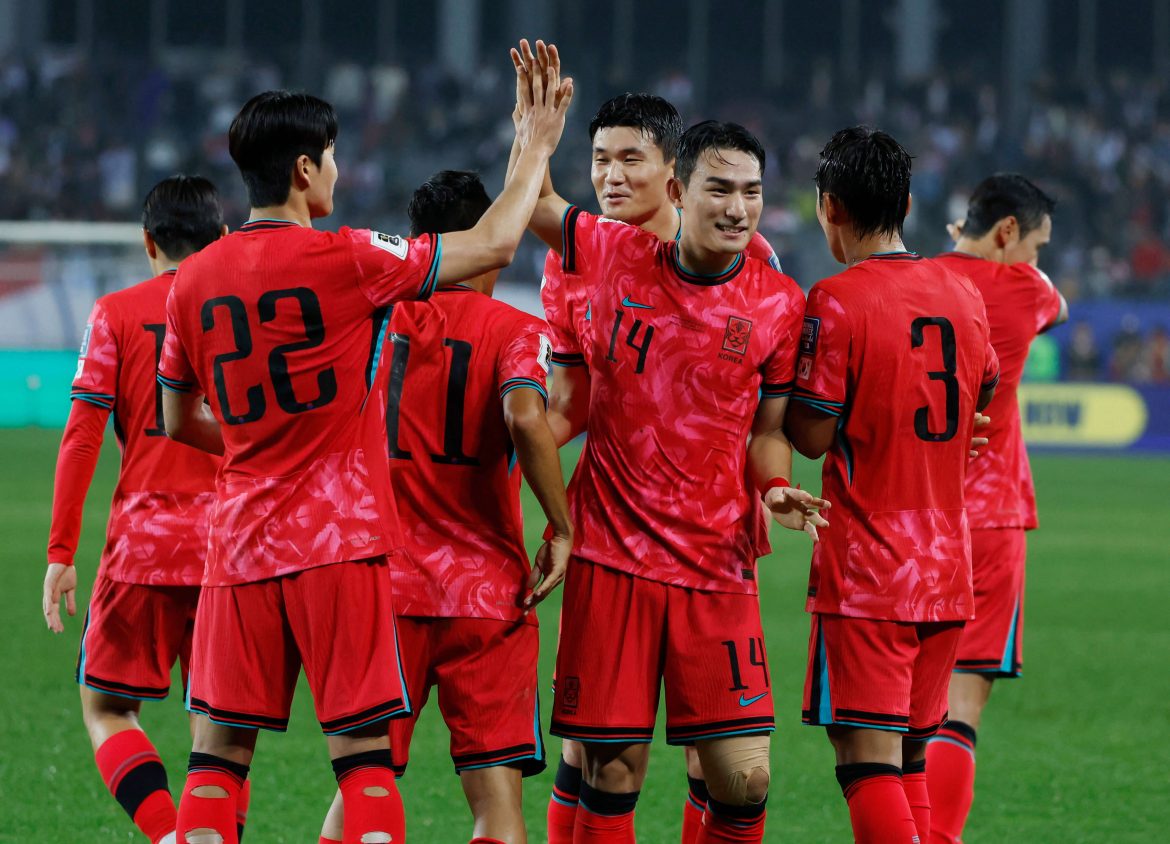 Members of South Korea's men's national football team celebrate after beating Iraq, 2-0, to qualify for the FIFA World Cup 2026. South Korea nails FIFA World Cup 2026 berth