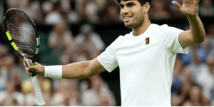Spain's Carlos Alcaraz lets out a smile after beating Britain's Cam Norrie in their Wimbledon quarterfinals match on Tuesday. Alcaraz to face Fritz in Wimbledon semis; Sabalenka survives
