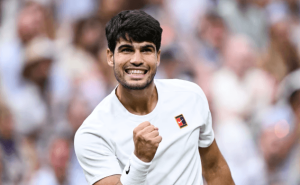 Spain's Carlos Alcaraz pumps his right fist after beating Anrey Rublev on Sunday. Alcaraz tops Rublev to get Wimbledon last 8; Sabalenka in quarters