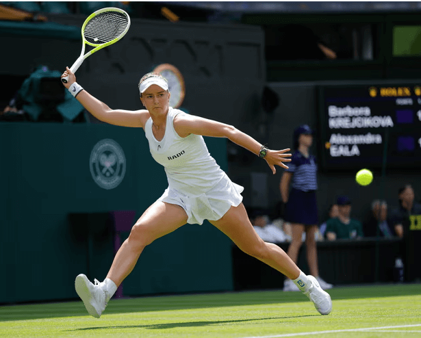 Czechia's barbora Krejcikova stretches for a shot against Alexandra Eala of the Philippines in their Wimbledon opener on Monday night. Gauff falls at Wimbledon as Krejcikova edges Eala; Draper wins