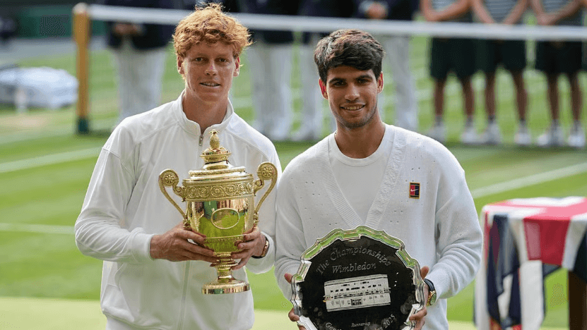 Italy's Jannik Sinner (left) and Spain's Carlos Alcaraz (right) hold their Wimbledon hardware after men's singles final on Sunday. Sinner vs Alcaraz rivalry heats up as Italian wins Wimbledon final