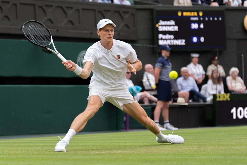 Italy's Jannik Sinner uses his right for a shot against Bulgaria's Grigor Dimitrov in their Wimbledon round-of-16 match on Monday. Sinner in Wimbledon last 8 as Dimitrov retires; Djokovic advances