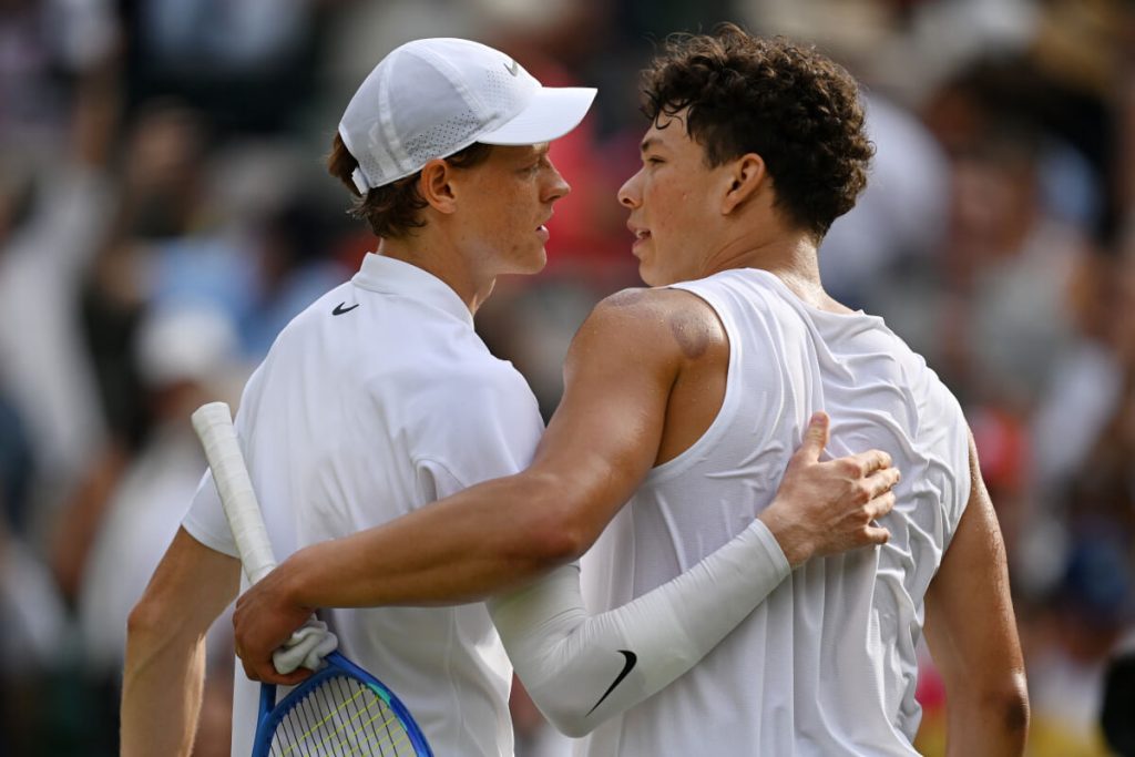 Italy's Jannik Sinner (left) shares a light moment with American Ben Shelton (right) after their Wimbledon quarterfinals match on Wednesday, Sinner reaches Wimbledon semis vs Djokovic; Swiatek in last four