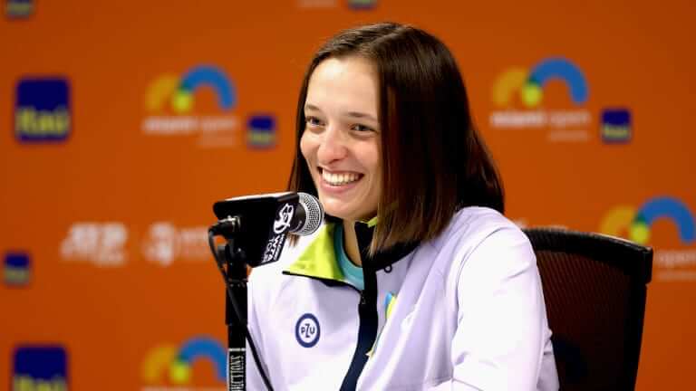 Poland's Iga Swiatek fields questions at a post match news conference after she won the Wimbledon women's singles final on Sunday. Swiatek rises to No.3 in WTA rankings; Sinner, Alcaraz top men