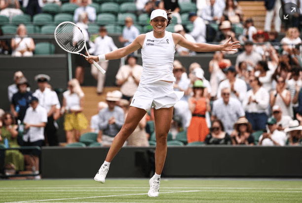 Poland's Iga Swiatek grins and raises her hands to celebrate her Wimbledon quarterfinals victory on Wednesday. Sinner reaches Wimbledon semis vs Djokovic; Swiatek in last four