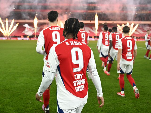 Arsenal players gather in the field and walk away in file photo.