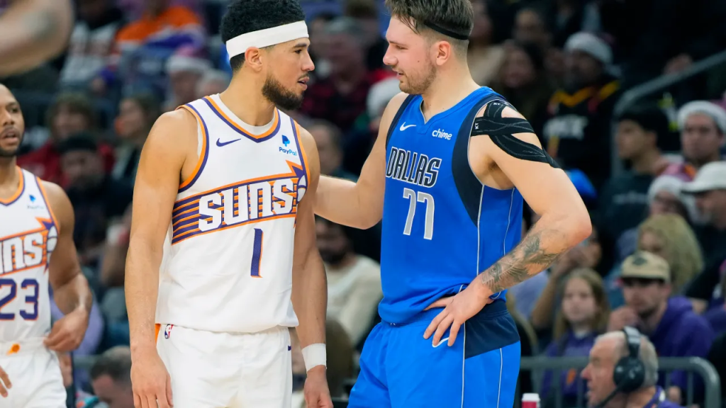 One of the best NBA Christmas Day games also came from Luka Doncic (77, right) and the Dallas Mavericks against Devin Booker (1, left) and the Phoenix Suns on December 25, 2023.