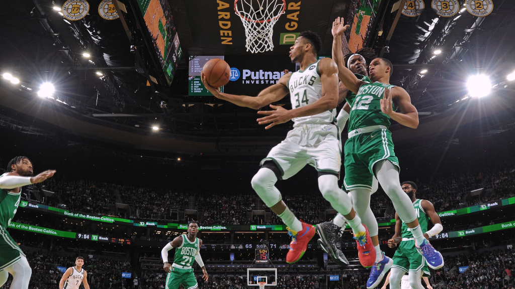 Giannis Antetokounmpo (34, left) delivered one of the best NBA Christmas Games in 2021 as he led the MIlwaukee Bucks over the Boston Celtics.